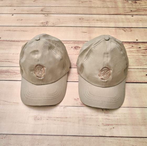 Beige satin baseball caps with embroidered monogram, pair, custom made by RestroCart, New Delhi