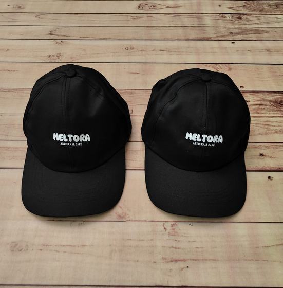 Black baseball caps with white printed logo, pair front view, custom made by RestroCart, New Delhi