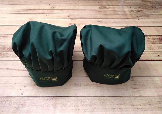 Green pleated toque chef hats with embroidered logo, pair, custom made by RestroCart, New Delhi