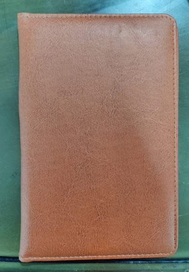 Closed tan brown leatherette bill folder with textured finish, custom made by RestroCart, New Delhi