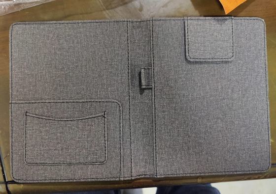 Open grey textured fabric bill folder with pockets and pen loop, custom made by RestroCart, New Delhi