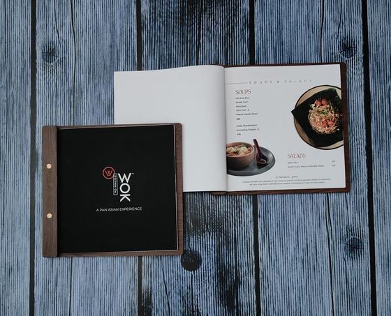 Wooden menu board with black cover and open printed menu pages, custom made by RestroCart, New Delhi