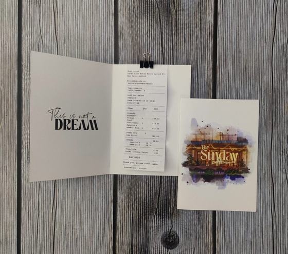 Folded white paper bill holder with receipt clip and art card, custom made by RestroCart, New Delhi